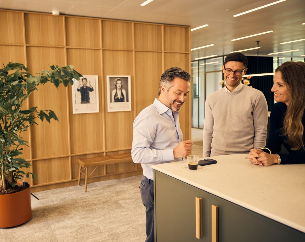 Avedon employees have a nice chat in the office